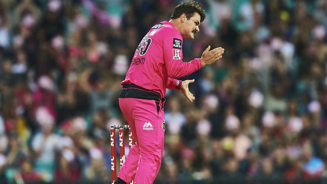 Sixers player Ben Manenti celebrates after taking the wicket of Chris Lynn during the Big Bash League match against Brisbane Heat.