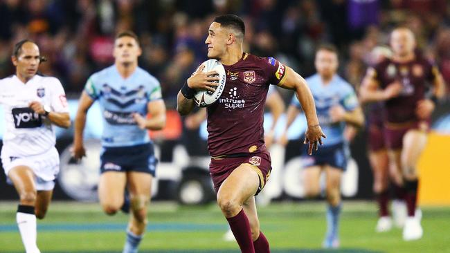 Valentine Holmes races away to score a try for the Maroons. Picture: Getty Images