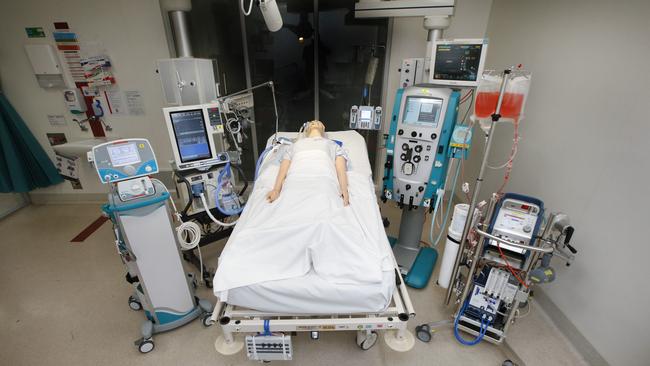 An Alfred Hospital intensive care bed and all the equipment used for coronavirus patient. (L-R) Inhaled nitric oxide to improve oxygen levels the blood, ventilator, an infusion pump, heart rate/blood pressure/oxygen saturation monitor, a dialysis machine and ECMO machine (extracorporeal membrane oxygenation). Picture: David Caird