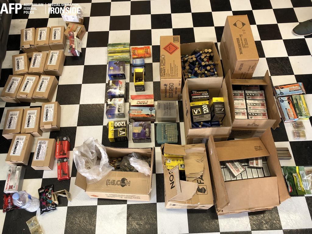 Boxes of ammunition and weapons were seized when officers executed 20 search warrants across the Sydney metropolitan area this week. Picture: AFP