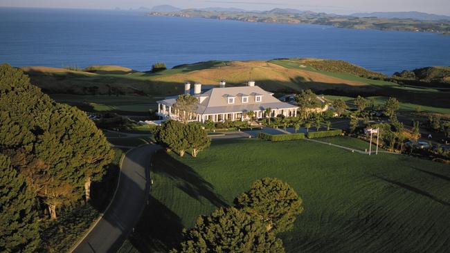 Long shadows settle over the lodge at dusk at Kauri Cliffs Resort, New Zealand.