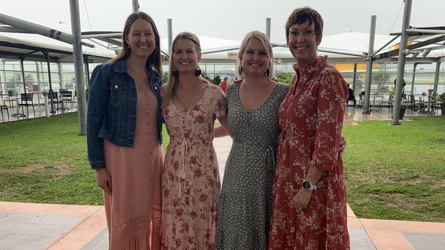 Ciane Rogers, Cara Kenny, Natalie Mitchell and Julia Crundell ready for a girls weekend starting with a flight to Uluru. Picture: Lillian Watkins