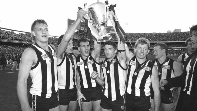 (from left) Damian Monkhorst, Craig Kelly, Darren Millane, Scott Russell and Shane Kerrison hold the 1990 premiership cup.