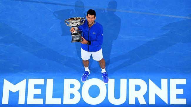 The king of Melbourne: Seven-time Australian Open winner Novak Djokovic poses with the Norman Brookes Challenge Cup after his historic victory. Picture: Quinn Rooney/Getty Images