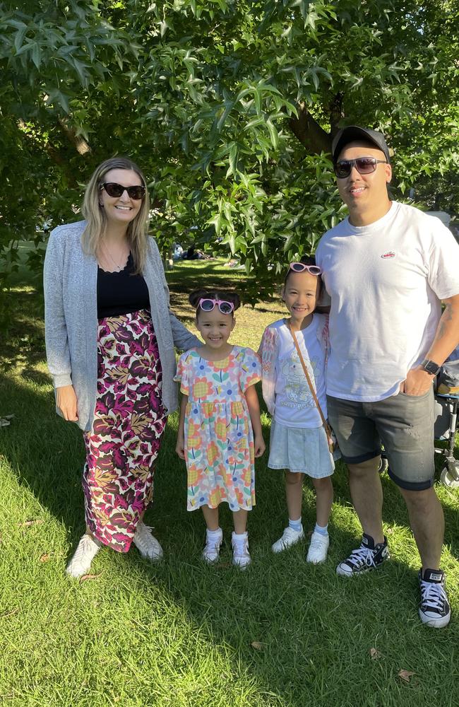 Tina &amp; Michael Morley and kids at Treasury Gardens in the Melbourne CBD for the 2024 New Year's Eve fireworks. Picture: Gemma Scerri