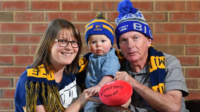 Graham Johnson with his daughter Rebecca Leach and grandson Hunter. Image: AAP/Keryn Stevens