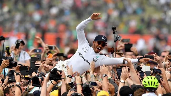Mercedes' British driver Lewis Hamilton celebrated winning the British Grand Prix