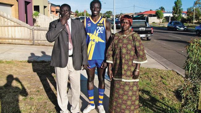 Majak with his parents. The family migrated to Australia in 2003. Picture: Supplied