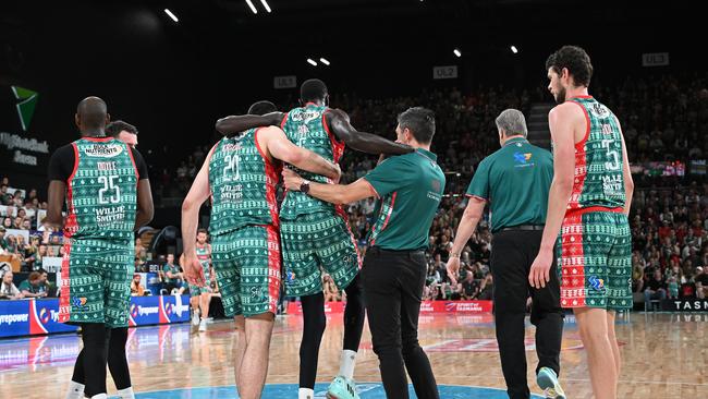 Majok Deng leaves the court injured during the round 12 NBL match between Tasmania JackJumpers and South East Melbourne Phoenix at MyState Bank Arena, on December 25, 2023, in Hobart, Australia. (Photo by Steve Bell/Getty Images)