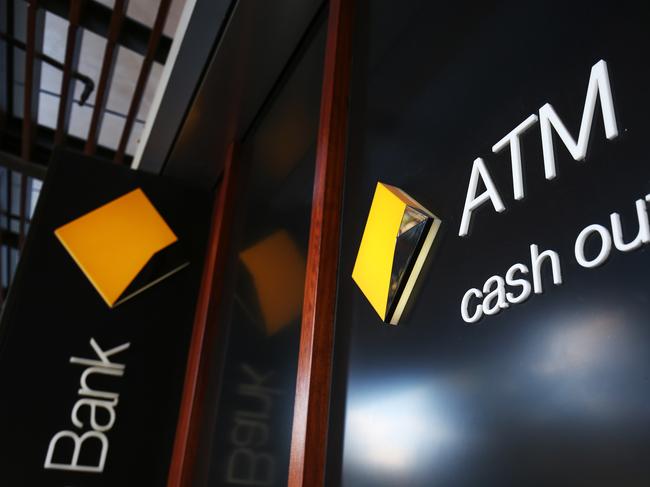 Signage for automated teller machines (ATM) is displayed outside a Commonwealth Bank of Australia branch in Sydney, Australia, on Monday, Aug. 7, 2017. Commonwealth Bank has blamed a software coding error for more than 50,000 alleged breaches of money-laundering and terrorist-financing laws. Photographer: Brendon Thorne/Bloomberg