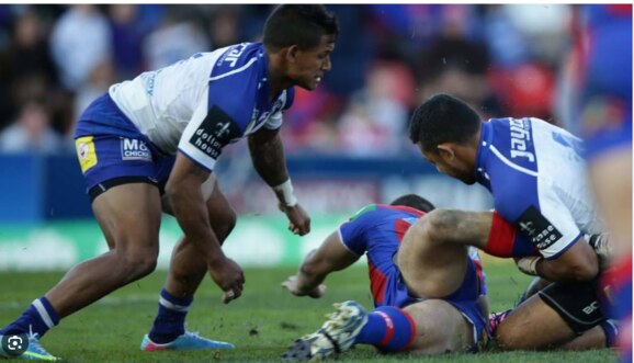 Krisnan Inu was charged for this scorpion tackle. Picture: Newcastle Herald