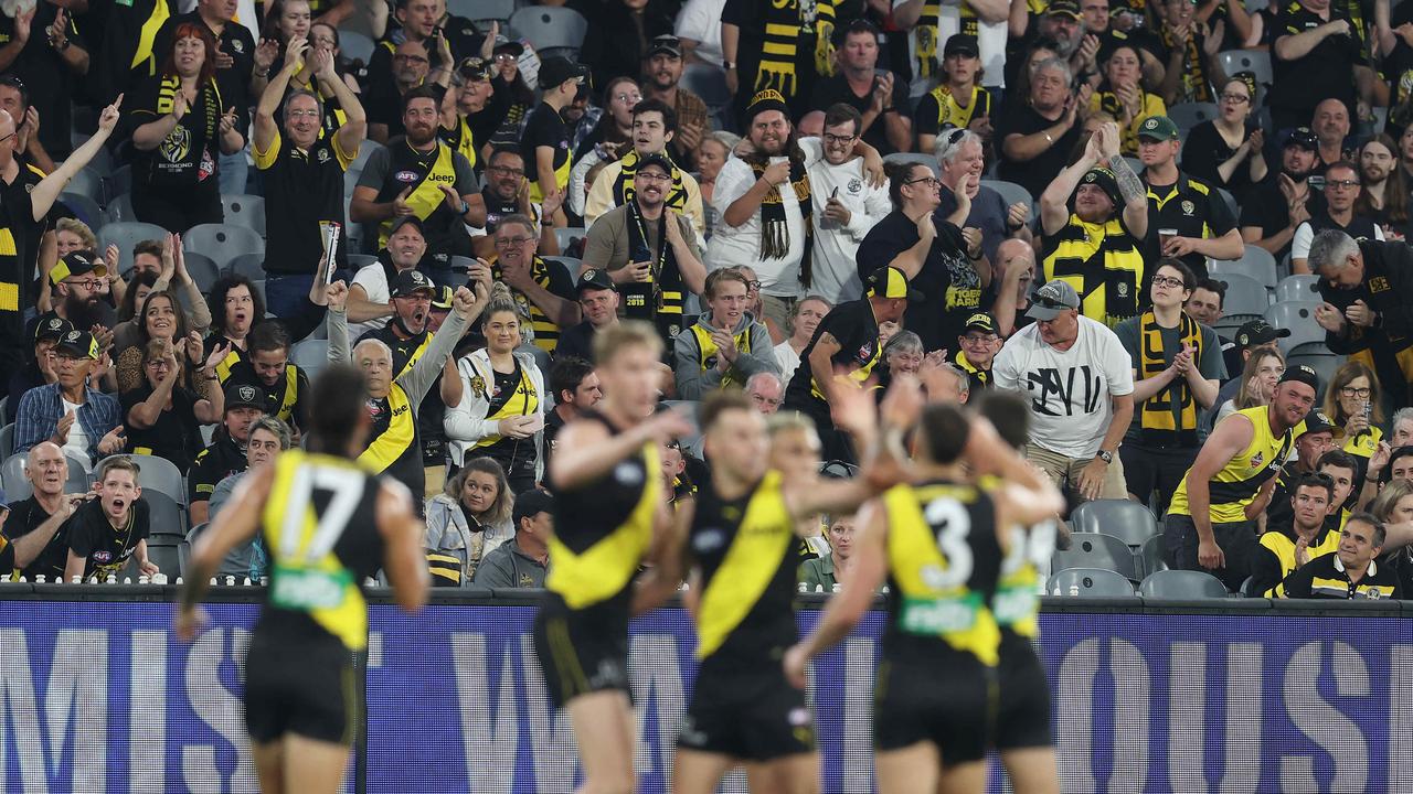 AFL Round 1. 18/03/2021. Richmond vs Carlton at the MCG, Melbourne.   Richmond fans celebrate a  Jake Aarts goal during the 1st qtr.    . Pic: Michael Klein