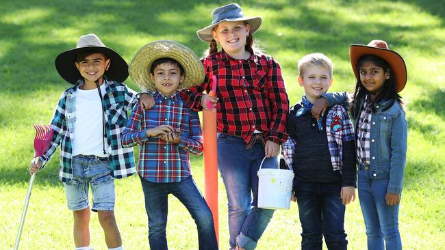 Zane, Mahmoude, Ruby, Malachi and Ayana from Bankstown West Public School got into the spirit to help struggling farmers across the country. Picture: Brett Costello