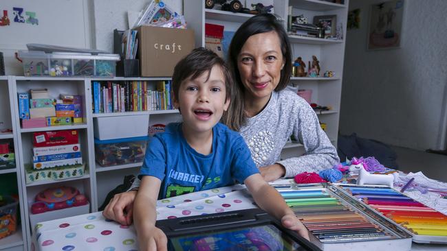 Grade 1 student Cam with mum Avril Shihab doing working from home for school. Picture by Wayne Taylor