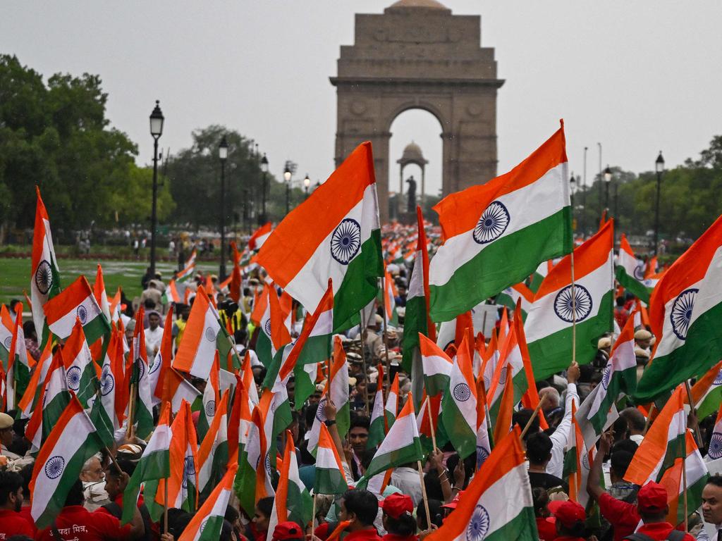 People waving Indian national flags along the Kartavya Path near India Gate, expressing solidarity with the armed forces following the ceasefire with Pakistan. Picture: Arun Sankar / AFP)