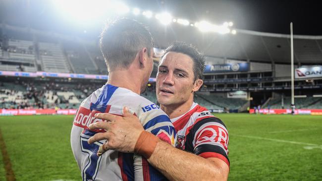 Cooper Cronk (right) of the Roosters with Mitchell Pearce of the Knights. Photo: AAP