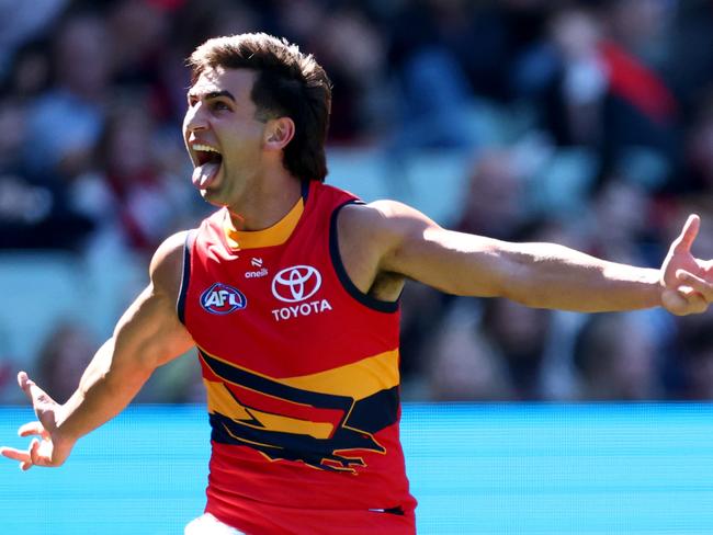 MELBOURNE, AUSTRALIA - MARCH 22: Izak Rankine of the Crows celebrates kicking a goal during the round two AFL match between Essendon Bombers and Adelaide Crows at Melbourne Cricket Ground, on March 22, 2025, in Melbourne, Australia. (Photo by Josh Chadwick/AFL Photos/via Getty Images)