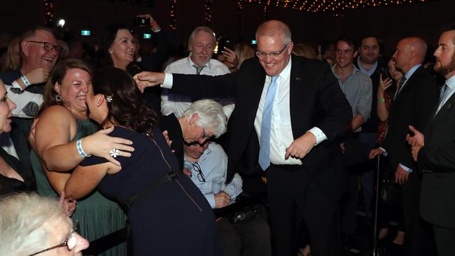 Scott Morrison and his wife Jenny celebrate his shock win at the Coalition’s official election night function in Sydney. Picture: Gary Ramage