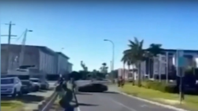 Stills showing a black BMW involved in an alleged hooning incident which left two people injured at Coomera. Picture: 9News