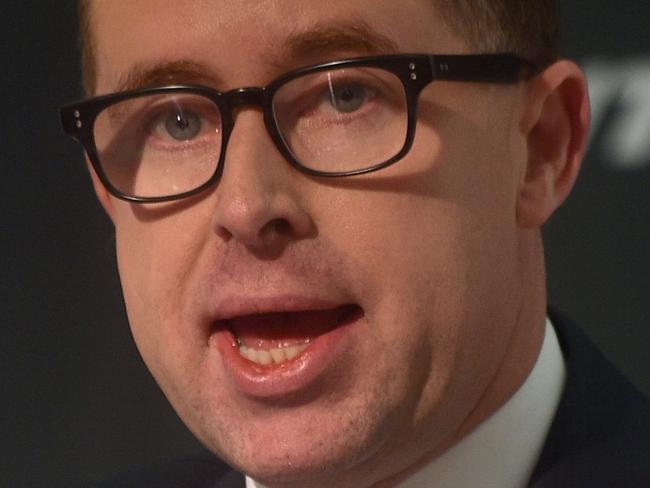 Qantas Chief Executive Officer Alan Joyce announces the airlines annual results in Sydney on August 24, 2016. Australian national carrier Qantas soared to a record annual net profit of 1.08 billion USD in the year to June 30 and announced a first payout to shareholders in seven years in a strong turnaround after major restructuring. / AFP PHOTO / PETER PARKS