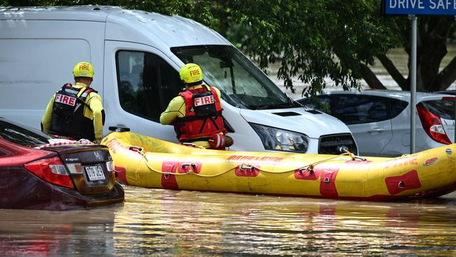 1/122024: Flash flooding in Hanlon Park , rapidly flooded around 10 cars, as police and fire and rescue  check the cars are empty, Stones Corner, Brisbane. pic: Lyndon Mechielsen/Courier Mail