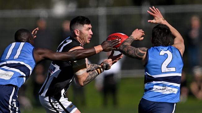 Point Cook Centrals’ Kwar Ater and Corey Vandermeer pressure Parkside’s Nathan Montague. Picture: Andy Brownbill