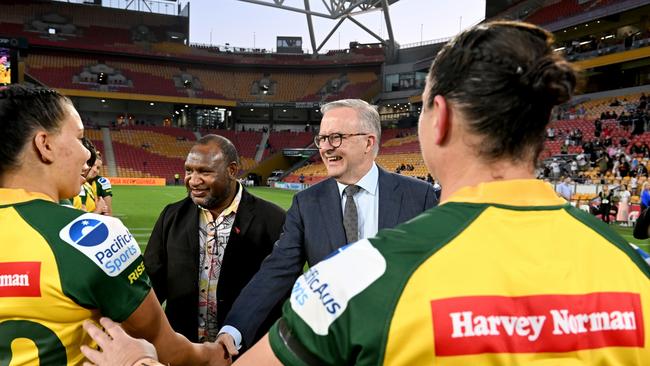 Papua New Guinea’s Prime Minister James Marape joins Anthony Albanese in greeting Australia’s women’s team ahead of a PMs’ XIII match at Suncorp Stadium. Picture: Getty Images