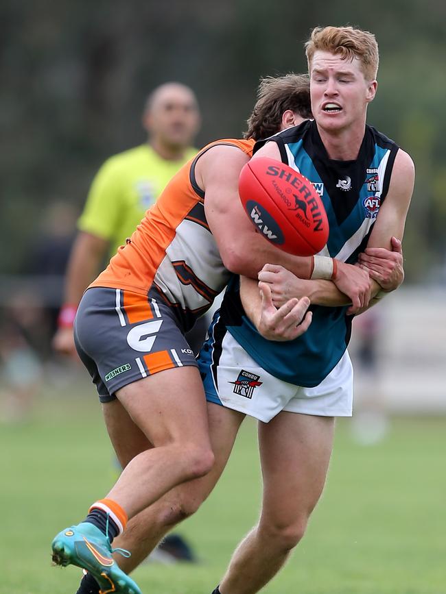 CDHBU’s Andrew Phibbs is tackled by a RWWW Giants opponent. Picture: Yuri Kouzmin