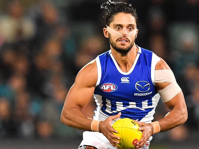 Aaron Hall of the Kangaroos runs with the ball during a match between Port Adelaide and North Melbourne at Adelaide Oval. Picture: DANIEL KALISZ/GETTY IMAGES