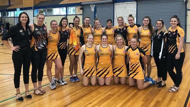 The 2018 Capricorn Claws netball team with coach Zoe Seibold.