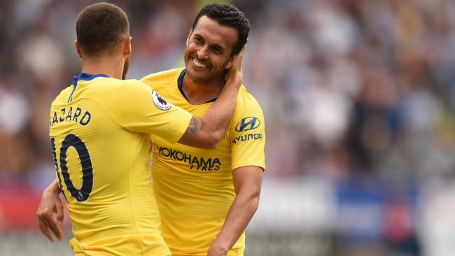 Chelsea's Spanish midfielder Pedro, right, celebrates with teammate Eden Hazard after scoring against Huddersfield. Picture: AFP