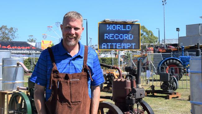 World record marketing co-ordinator Craig Tunley dons his overalls in preparation for the 'most overalls worn at once' world record attempt at the Dalby Show 2023. Picture: Emily Devon