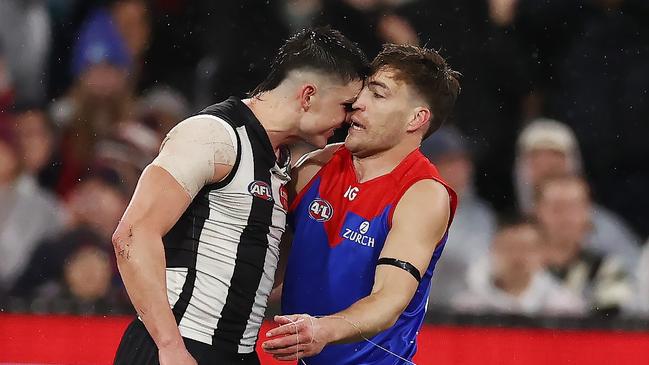 Jack Viney and Brayden Maynard face-off after the Collingwood star’s heavy hit on Angus Brayshaw. Photo by Michael Klein.