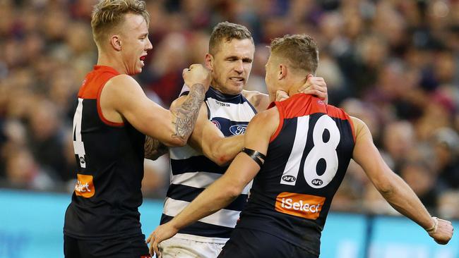 Joel Selwood remonstrates with Jake Melksham, giving away as free kick as Tom Hawkins was lining up for goal. Picture: Michael Klein