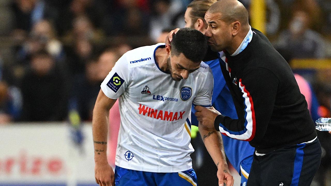 Australian coach Patrick Kisnorbo congratulates ES Troyes' French midfielder, Xavier Chavalerin, after he scored his team's third goal. Picture: Sebastien Bozon / AFP