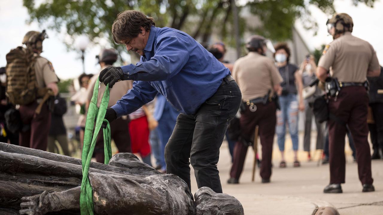 A statue of Christopher Columbus, toppled to the ground by protesters, is loaded onto a truck on the grounds of the State Capitol in St Paul, Minnesota. Picture: Stephen Maturen/Getty Images/AFP