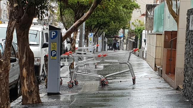 Abandoned trolleys block the footpath near Norton St, Leichhardt.