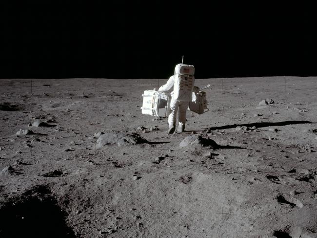 Forty-nine years ago on July 20, 1969, humanity stepped foot on another celestial body and into history. Mission Commander Neil Armstrong documented the lunar mission and snapped this image of Lunar Module Pilot Buzz Aldrin, as he carried the Passive Seismic Experiments Package (in his left hand) and the Laser Ranging Retroreflector (in his right) to the deployment area. These two experiments made up the Early Apollo Scientific Experiment Package. This photograph was taken at Tranquility Base in our Moon's Mare Tranquillitatis, or Sea of Tranquility.Original film magazine was labeled S. Film Type: Ektachrome EF SO168 color film on a 2.7-mil Estar polyester base taken with a 60mm lens. Sun angle is sedium. Tilt direction is South (S).Image Credit: NASA