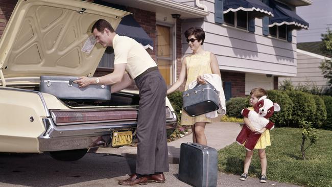 Getting ready to hit the road. with matching luggage and teddy bear. Picture: Getty Images