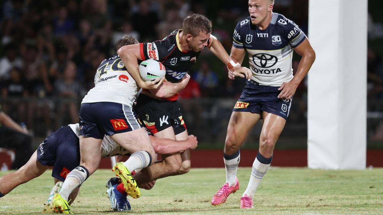 Dolphins' Jordan Lipp is wrapped up by the Cowboys defence in the National Rugby League (NRL) pre season NRL match between the North Queensland Cowboys and the Dolphins, held at Barlow Park. Picture: Brendan Radke