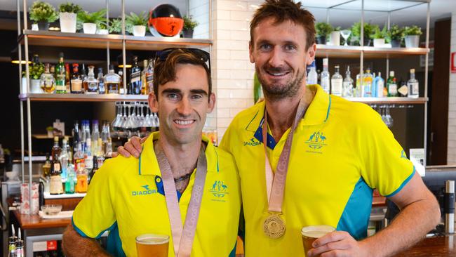 McHugh with Damien Schumann and their Commonwealth Games gold medals. Picture: Brenton Edwards (AAP).