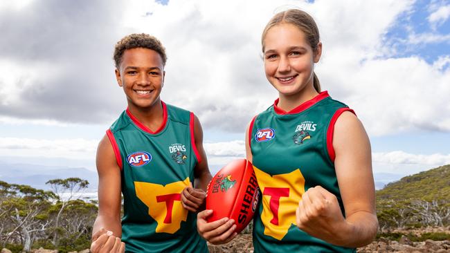 Shaun Kongwa and Mia Barwick sporting the new Tasmania Devils jumpers. Picture: Linda Higginson / Tasmania Football Club