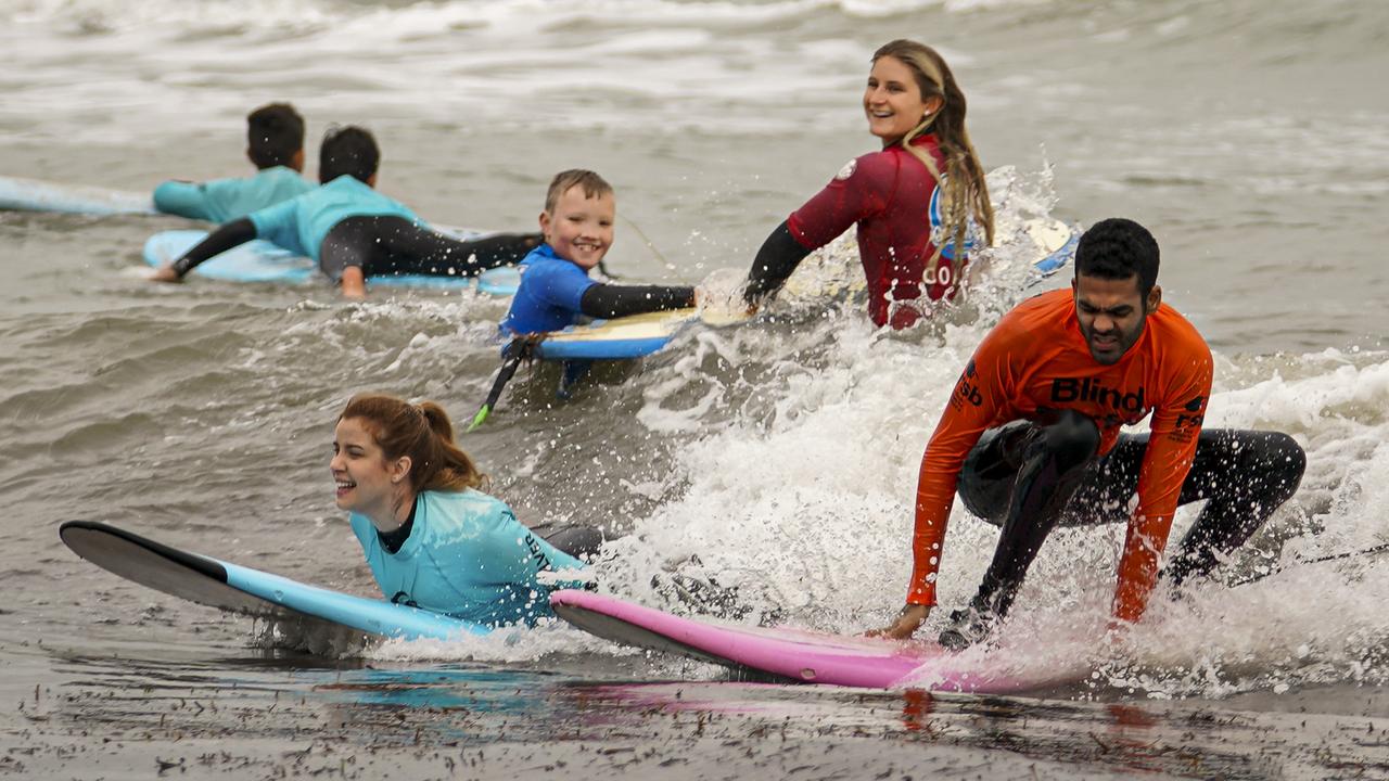 Derek Rabelo and Rachael Leahcar - at Glenelg Beach for Royal Society for the Blind surfing event Saturday June 15, 2019 - pic AAP/MIKE BURTON