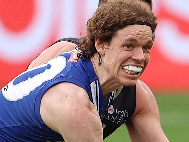 AFL Round 8 . 25/07/2020.   North Melbourne vs Carlton at the Gabba, Brisbane.  Ben Brown of the Kangaroos marks infront of Jacob Weitering of the Blues q3  . Pic: Michael Klein