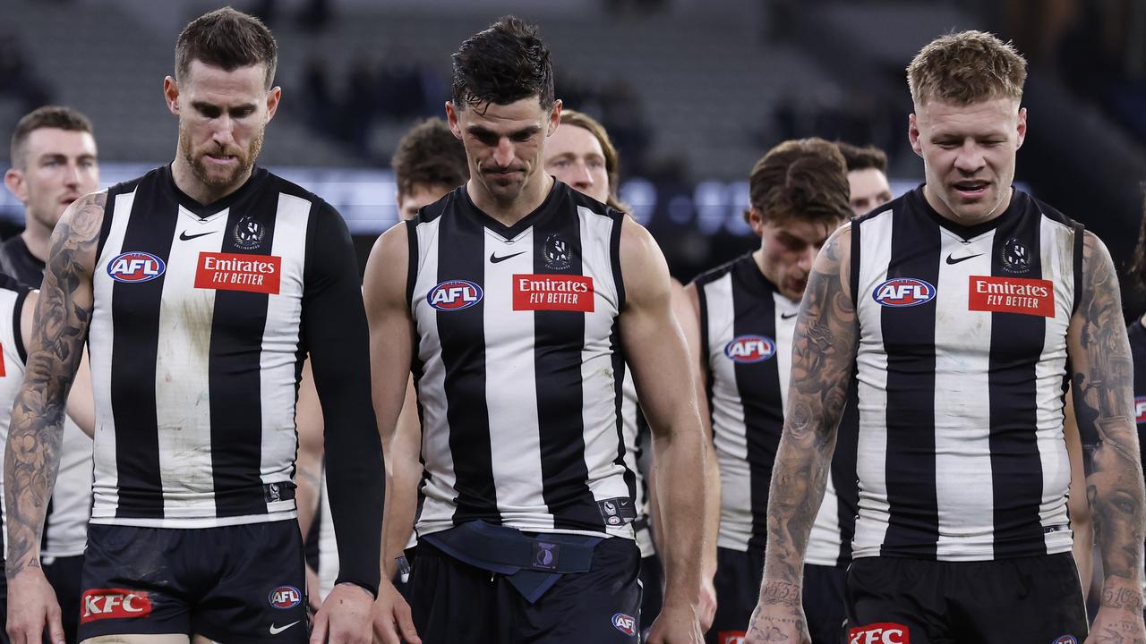 MELBOURNE, AUSTRALIA - JULY 28: Collingwood players walk from the ground after the round 20 AFL match between Collingwood Magpies and Carlton Blues at Melbourne Cricket Ground, on July 28, 2023, in Melbourne, Australia. (Photo by Darrian Traynor/Getty Images)