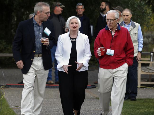 Federal Reserve Chair Janet Yellen strolls with Stanley Fischer, right, vice chairman of the Board of Governors of the Federal Reserve System, and Bill Dudley, the president of the Federal Reserve Bank. Picture: AP.