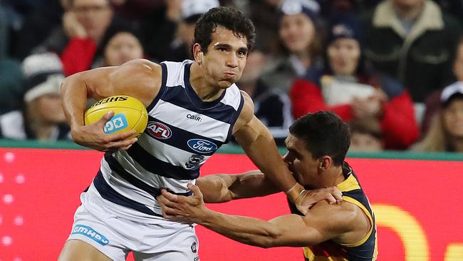 Nakia Cockatoo shrugs off Charlie Cameron. Picture: Michael Klein