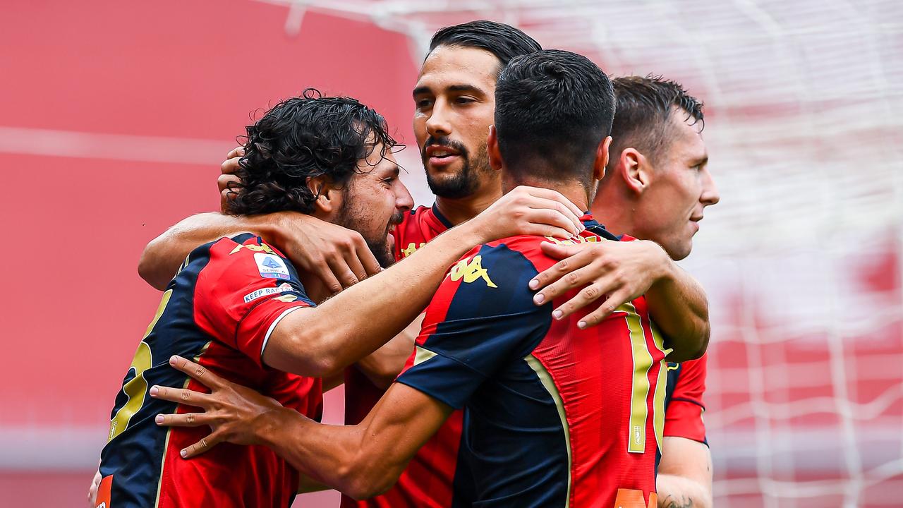 Mattia Destro (L) is one of 16 Genoa players to have tested positive for COVID-19.