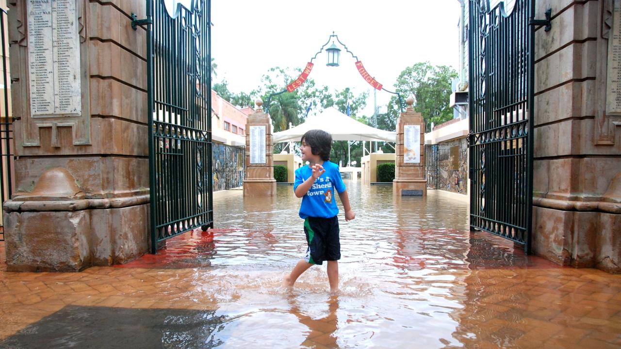 Kaydin Vonschoeler enjoys the first floodwater to enter through the Memorial Gates. Picture: Craig Warhurst, The Gympie Times