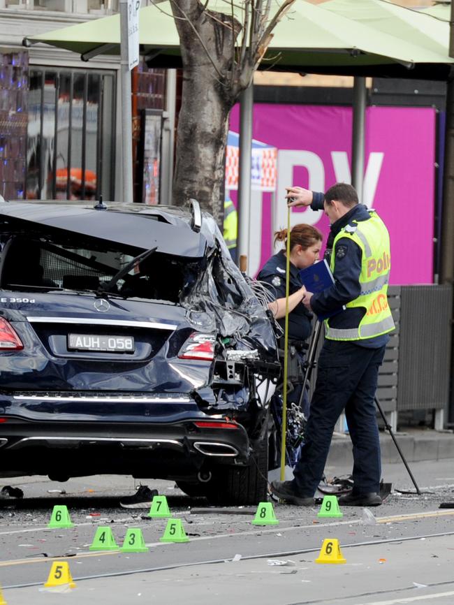 Police investigate at the scene. Picture: Andrew Henshaw